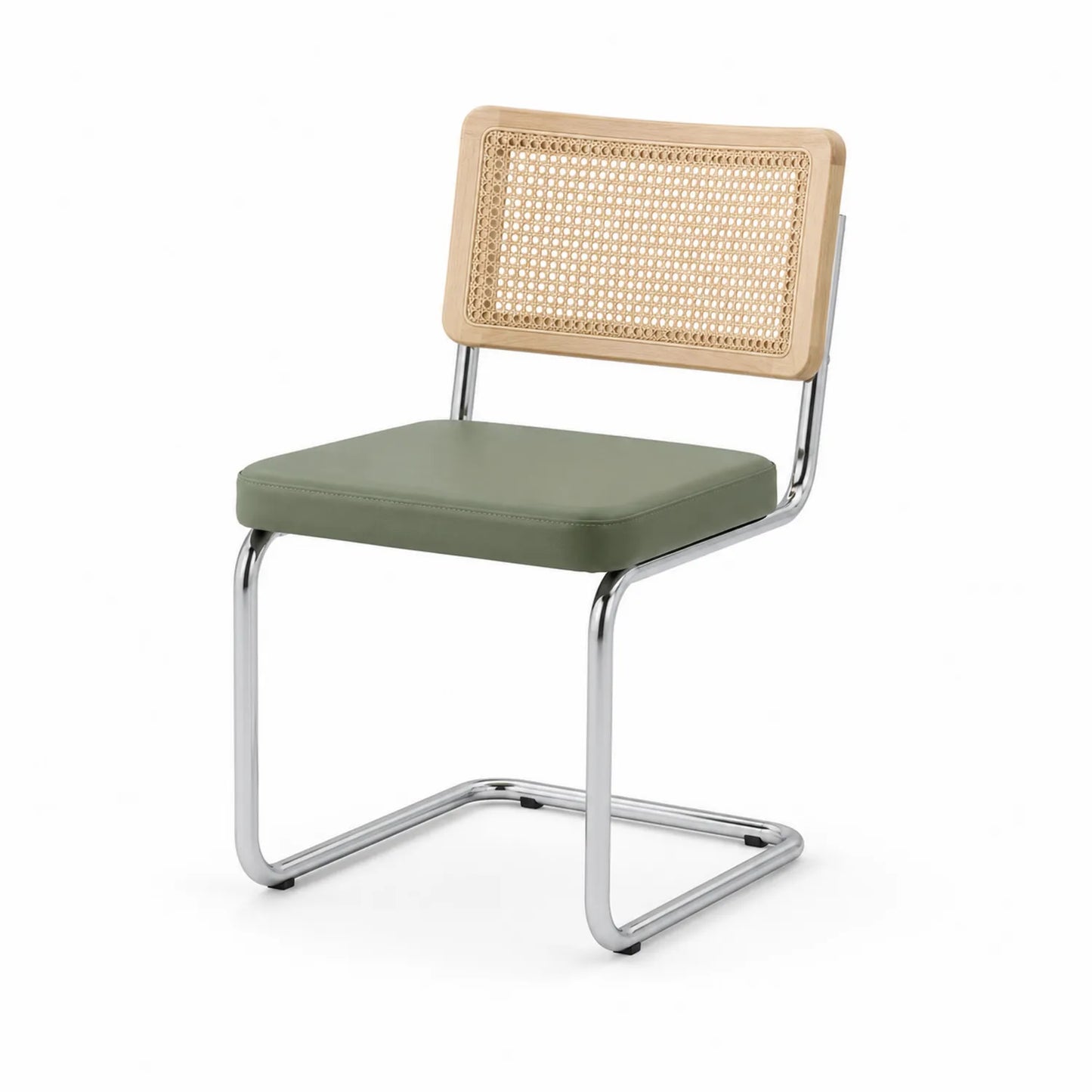 Silla de comedor de acero cromado con asiento de PU verde y respaldo de ratán